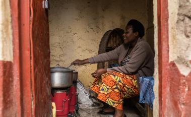 Therese Mukamana uses a biomass stove in Gyseny, Rwanda.